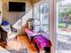 Relaxing sunroom with tiled floor and views to backyard and greenery at 244 Kings Pond Ave, Winter Haven, FL 33880