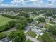 An aerial view of a property showcasing its prime location near lush greenery at 257 Padgett N Pl, Lakeland, FL 33809