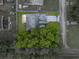 Aerial view showcasing the property boundary, mature trees and community landscape at 257 Padgett N Pl, Lakeland, FL 33809