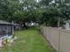 Backyard shot of the home with a fence at 257 Padgett N Pl, Lakeland, FL 33809
