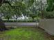 View of the backyard beyond a metal fence at 257 Padgett N Pl, Lakeland, FL 33809