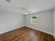 Bedroom featuring hardwood floors, ceiling fan, and a window at 257 Padgett N Pl, Lakeland, FL 33809