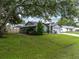 Charming single-story home with well-maintained lawn and mature trees at 257 Padgett N Pl, Lakeland, FL 33809