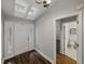 Bright foyer featuring wood floors, skylights, decorative door and an adjacent half-bathroom at 257 Padgett N Pl, Lakeland, FL 33809