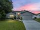 Charming one story home with a well maintained lawn and mature tree in front at 257 Padgett N Pl, Lakeland, FL 33809