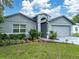 Charming single story home with a manicured lawn and tasteful landscaping in front at 257 Padgett N Pl, Lakeland, FL 33809