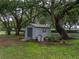 Backyard shot of storage shed on grass lot at 257 Padgett N Pl, Lakeland, FL 33809