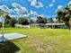 The back yard has ample grass and chain link fence to the neighboring home at 2655 Hempstead Dr, Lakeland, FL 33801