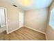 This bedroom features vinyl floors and one window at 2655 Hempstead Dr, Lakeland, FL 33801
