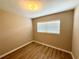 This bedroom features vinyl floors and a window at 2655 Hempstead Dr, Lakeland, FL 33801