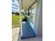 Side view of a light gray home showing the entryway and part of the front lawn at 2655 Hempstead Dr, Lakeland, FL 33801