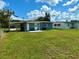 Exterior view of house with a covered parking area in the back yard at 2655 Hempstead Dr, Lakeland, FL 33801