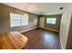 Spacious living area with wood-look flooring, natural light, a ceiling fan, and a breakfast table at 2655 Hempstead Dr, Lakeland, FL 33801