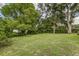 Serene backyard with mature trees and a hammock, creating a private and relaxing outdoor oasis at 2726 Cleveland Heights Blvd, Lakeland, FL 33803