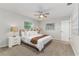 A relaxing bedroom includes a ceiling fan, two large windows, and neutral decor at 2726 Cleveland Heights Blvd, Lakeland, FL 33803
