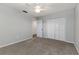 Spacious bedroom features neutral walls, carpet, and a ceiling fan for added comfort at 2726 Cleveland Heights Blvd, Lakeland, FL 33803