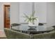 Elegant dining room with modern glass table and seating, bathed in soft natural light at 2726 Cleveland Heights Blvd, Lakeland, FL 33803