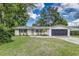 Charming single-story home with a well-maintained lawn, freshly painted exterior, and a two car garage at 2726 Cleveland Heights Blvd, Lakeland, FL 33803