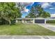 Charming single-story home with a well-maintained lawn, freshly painted exterior, and a two car garage at 2726 Cleveland Heights Blvd, Lakeland, FL 33803