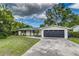 Charming single-story home with a well-maintained lawn, freshly painted exterior, and a two car garage at 2726 Cleveland Heights Blvd, Lakeland, FL 33803