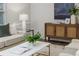Inviting living room with a comfortable sofa, stylish coffee table, and a decorative cabinet at 2726 Cleveland Heights Blvd, Lakeland, FL 33803