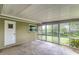 A spacious screened porch with access to the backyard, perfect for outdoor entertaining at 2726 Cleveland Heights Blvd, Lakeland, FL 33803