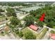Aerial view of the property with a lake view in the background at 330 Diesel Rd, Mulberry, FL 33860
