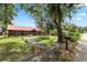 View of the home's front exterior with a long driveway and well-kept landscaping at 330 Diesel Rd, Mulberry, FL 33860