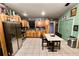 Spacious kitchen featuring stainless steel appliances, a dining area, and access to the exterior at 330 Diesel Rd, Mulberry, FL 33860