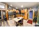 Open kitchen with stainless appliances, a dining table, and convenient access to other areas at 330 Diesel Rd, Mulberry, FL 33860