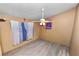 Versatile room featuring a ceiling fan, and hardwood floors, flooded with natural light at 330 Diesel Rd, Mulberry, FL 33860