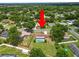 Aerial view showcasing the home, screened-in pool, large backyard, and the surrounding neighborhood at 3315 Cross Fox Dr, Mulberry, FL 33860
