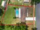 Aerial view showing home with pool, lush lawn, and privacy fenced-in yard at 3315 Cross Fox Dr, Mulberry, FL 33860