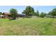 Expansive backyard featuring lush green lawn, mature trees, and screened-in pool area perfect for outdoor enjoyment at 3315 Cross Fox Dr, Mulberry, FL 33860
