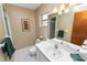 Bathroom featuring a well-lit vanity with a large mirror, shower and tiled floors at 3315 Cross Fox Dr, Mulberry, FL 33860
