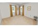 Bright bedroom with natural light from two windows with decorative curtains at 3315 Cross Fox Dr, Mulberry, FL 33860