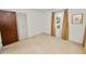 This bedroom features neutral carpeting, a window with golden curtains, and a closet with folding doors at 3315 Cross Fox Dr, Mulberry, FL 33860