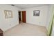 Bright bedroom featuring neutral walls, carpet, and vintage wood furnishings at 3315 Cross Fox Dr, Mulberry, FL 33860