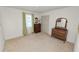 Bright bedroom featuring neutral walls, carpet, and vintage wood furnishings at 3315 Cross Fox Dr, Mulberry, FL 33860