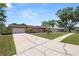 Charming single-story home with a two-car garage and long driveway at 3315 Cross Fox Dr, Mulberry, FL 33860