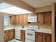 Cozy kitchen with ample cabinet space and neutral countertops at 3315 Cross Fox Dr, Mulberry, FL 33860