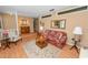 Comfortable living room featuring hardwood floors, classic furniture, and plenty of natural light at 3315 Cross Fox Dr, Mulberry, FL 33860