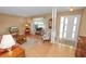 Bright and inviting living room with hardwood floors, a large window, and a comfortable seating area at 3315 Cross Fox Dr, Mulberry, FL 33860