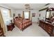 Comfortable main bedroom with carpeted floors, classic decor, and ample natural light from large windows at 3315 Cross Fox Dr, Mulberry, FL 33860