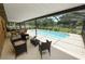 Inviting screened-in patio with comfortable seating next to a refreshing pool at 3315 Cross Fox Dr, Mulberry, FL 33860