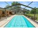 Sparkling pool with a screened enclosure, offering privacy and outdoor enjoyment at 3315 Cross Fox Dr, Mulberry, FL 33860
