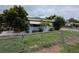 View of home showcasing fenced yard and manicured landscaping at 337 Pearl St, Lake Wales, FL 33853