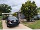 A charming single-story home featuring mature trees and a driveway with parking at 337 Pearl St, Lake Wales, FL 33853