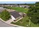 Aerial view of a well-kept home with landscaped yard, mature trees, and a private backyard at 3370 Highland Fairways Blvd, Lakeland, FL 33810