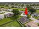 Aerial view of the property showing the house, roof, and surrounding neighborhood at 3370 Highland Fairways Blvd, Lakeland, FL 33810